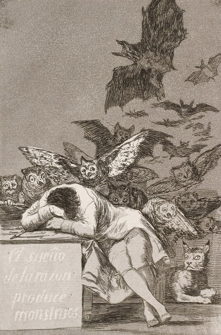 A man asleep at his desk with his head on his arms, while owls and bats swarm out of the darkness behind him and a lynx watches from the floor.